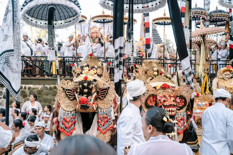 Bali beach with Tanah Lot temple in the background at sunset