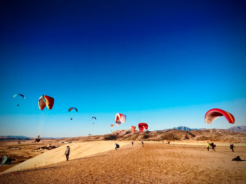 
Tandem paragliding over Ölüdeniz Beach in Fethiye, Turkey with turquoise lagoon and mountain see views