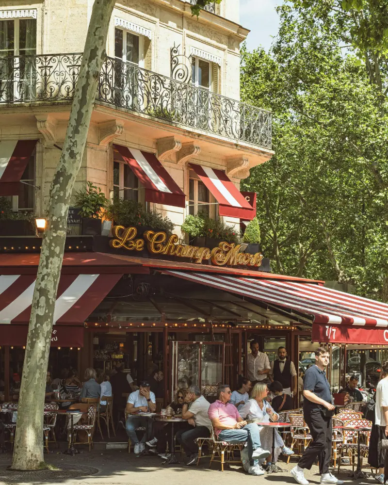 sunny day in paris, people enjoying outside in the bar
