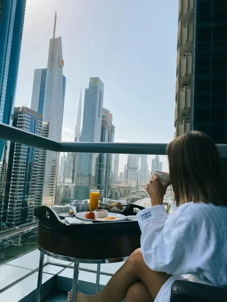 Luxurious hotel room with floor-to-ceiling windows and Burj Khalifa view
