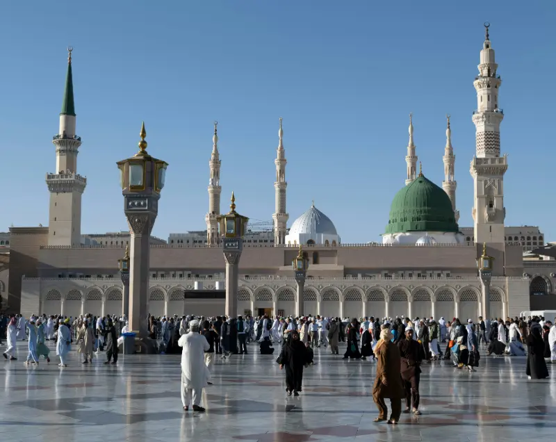Architectural details of the Prophet Mosque in Medina, Saudi Arabia including domes and minarets